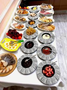 a table with many plates of food on it at The green regency in Toshkent-Passajir Bekati +17 photos