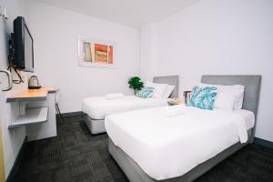 Ένα ή περισσότερα κρεβάτια σε δωμάτιο στο Swing & Pillows - KL Sg Besi, Kuala Lumpur +47 φωτογραφίες