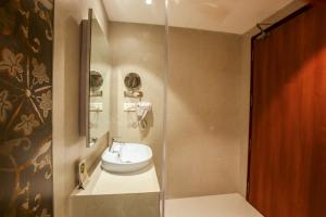 a bathroom with a sink and a shower at Amity's Courtyard in Jāmb +29 photos