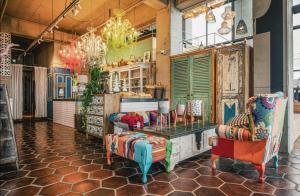 a store with two chairs and a table in a room at Tropical Hideaway in Seogwipo