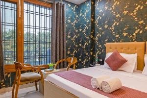 Ένα ή περισσότερα κρεβάτια σε δωμάτιο στο Hotel Admire Expressway by ASPL +79 φωτογραφίες