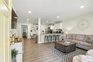 a living room with a couch and a table at Athenian Haus with Grill in Athens