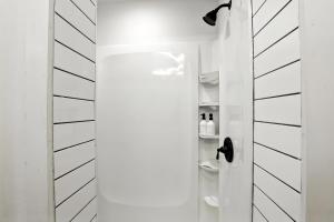 a bathroom with a toilet in a white room at Athenian Haus with Grill in Athens