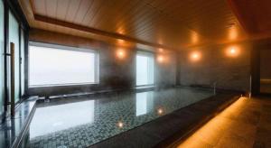 a large swimming pool in a room with a window at KEIKYU EX INN Haneda Innovation City 2 minutes walk from HICity Exit of Tenkubashi Station in Tokyo