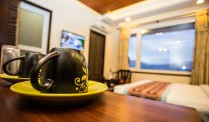 TV at/o entertainment center sa Hotel Encounter Nepal & Spa