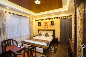 Kama o mga kama sa kuwarto sa Hotel Encounter Nepal & Spa