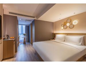 Ένα ή περισσότερα κρεβάτια σε δωμάτιο στο Orange Hotel Beijing Zhongguancun University of Science and Technology +14 φωτογραφίες