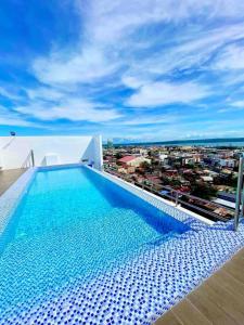 a swimming pool on the roof of a building at Bernwood Tower in Iloilo City