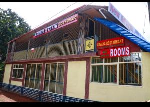 a building with signs on the side of it at Adhvaya stay in in Kumta