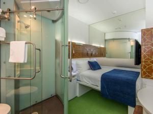 Ένα ή περισσότερα κρεβάτια σε δωμάτιο στο BreakFree on Cashel, an Accor Hotel +98 φωτογραφίες