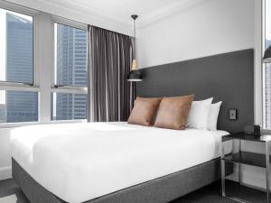 Ένα ή περισσότερα κρεβάτια σε δωμάτιο στο Mantra on Kent +37 φωτογραφίες