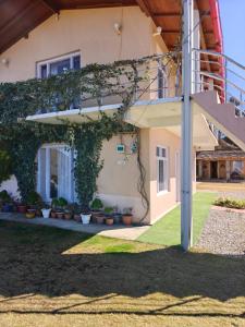 a house with plants on the side of it at Buransh Retreat in Jageshwar