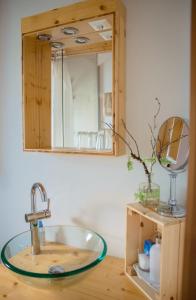 a bathroom with a sink and a mirror at Die Naradhube Ferienwohnungen Wolte in Abriach +17 photos