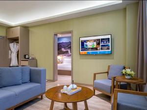 Μια τηλεόραση ή/και κέντρο ψυχαγωγίας στο Orange Hotel Beijing Yizhuang Bridge Subway Station