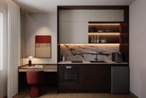 a kitchen with a counter and a red chair at HAITA Suites in Ho Chi Minh City +18 photos