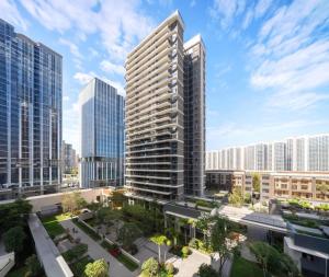 a view of a city with tall buildings at 来咖民宿酒店三亚市中心大悦城店 in Sanya