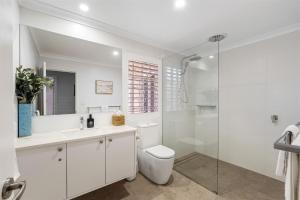 a white bathroom with a toilet and a shower at Clearwater Escape Dunsborough in Dunsborough +48 photos