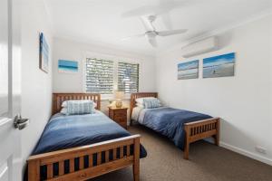 a bedroom with two beds and a window at Clearwater Escape Dunsborough in Dunsborough