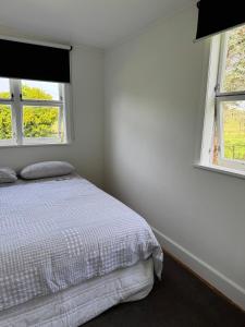 En eller flere senge i et værelse på Rato Retreat