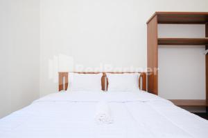 Postel nebo postele na pokoji v ubytování Danesty Homestay Sedayu near Universitas Mercu Buana Yogyakarta RedPartner