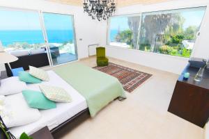 Ένα ή περισσότερα κρεβάτια σε δωμάτιο στο Panorama +12 φωτογραφίες