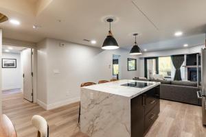 an open kitchen and living room with a large island at Main & SKY by EXMAR in Park City