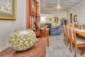 a vase sitting on a table in a living room at Marlyn 32 in Struisbaai
