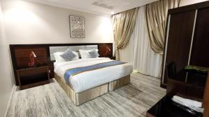 Postel nebo postele na pokoji v ubytování اجنحة الفرسان حى الفيصلية اماسي البشاير + 109 fotografií