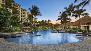 a pool at a resort with rocks in the water at Marriott's Ko Olina Beach Club- STUDIO in Kapolei