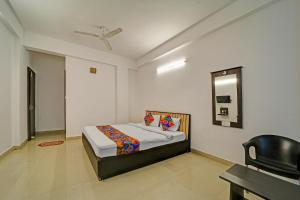 Ένα ή περισσότερα κρεβάτια σε δωμάτιο στο FabHotel Konark Green