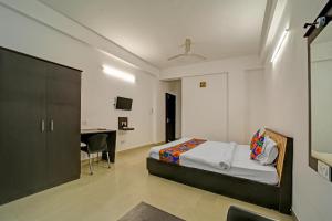 Ένα ή περισσότερα κρεβάτια σε δωμάτιο στο FabHotel Konark Green +20 φωτογραφίες