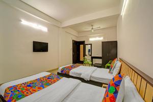 Ένα ή περισσότερα κρεβάτια σε δωμάτιο στο FabHotel Konark Green