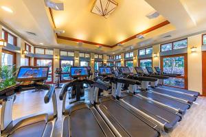 a gym with rows of treadmills and elliptical machines at Marriott's Ko Olina Beach Club- STUDIO in Kapolei