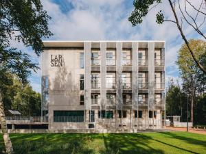 a building with the words lease san written on it at Sume by Larsen in Tallinn