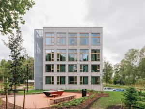a building with a bench in front of it at Sume by Larsen in Tallinn