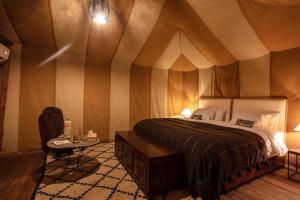 Ένα ή περισσότερα κρεβάτια σε δωμάτιο στο Mariana luxury camp