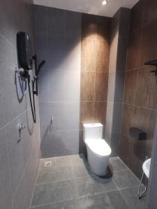 a bathroom with a white toilet and a shower at Room Only - RyuiBungalow 23'00-11'00 - Night Use - PROMO in Sungai Petani +9 photos