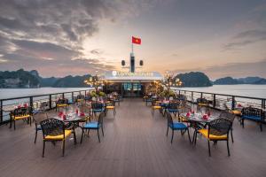 a restaurant on the deck of a cruise ship at L'amour Cruise in Ha Long
