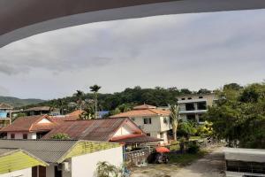 a view of a city with houses and buildings at Praew Mansion in Kamala Beach