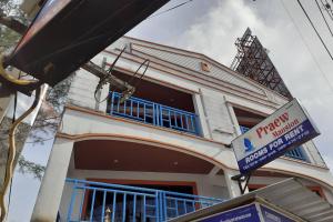 a building with a sign in front of it at Praew Mansion in Kamala Beach
