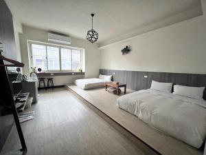 Ένα ή περισσότερα κρεβάτια σε δωμάτιο στο 客梢 Cushare #市政府商務住宿 #停車方便 #可包棟