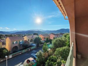 a view from a balcony of a residential neighbourhood at Casa Helena in Saint-Florent +3 photos