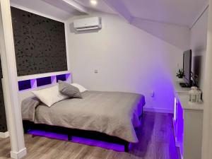 En eller flere senge i et værelse på La Casita del Escorial - Nueva Reforma