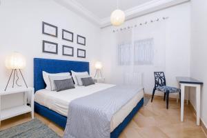 Ένα ή περισσότερα κρεβάτια σε δωμάτιο στο L'Oiseau Bleu Marsa Plage