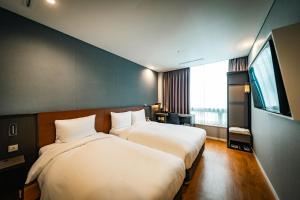 Postel nebo postele na pokoji v ubytování Arban City Hotel + 40 fotografií