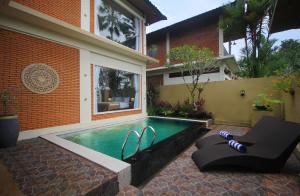 a swimming pool in the backyard of a house at 2 Bedrooms Private Pool Villa Tegalalang-Ubud in Tegalalang