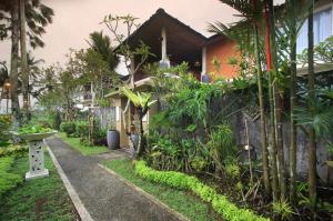 a walkway leading to a house with plants at 2 Bedrooms Private Pool Villa Tegalalang-Ubud in Tegalalang