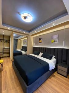 Postel nebo postele na pokoji v ubytování Peaky Hotel