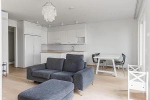 a living room with a couch and a table at Porvoo Sibelius - Free WiFi in Porvoo