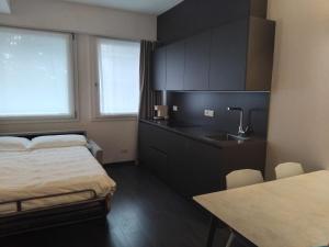 a hotel room with a bed and a sink at Venice Terminal Apartments & Suites in Mestre